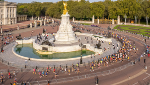 Queen Victoria Memorial with runners going around during The Royal Parks Half